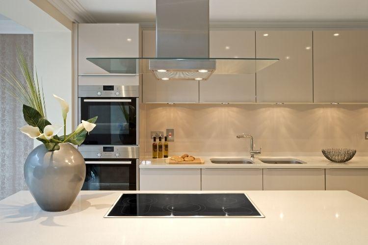 Modern kitchen with steel range hood island counter
